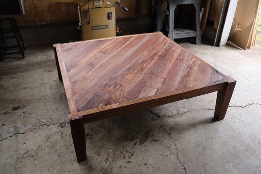 Full view of a brown handmade coffee table called the "castle Joint" coffee table